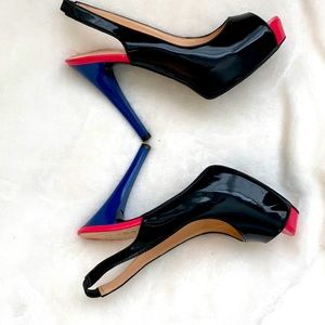 Black, pink and navy blue high heel shoe.